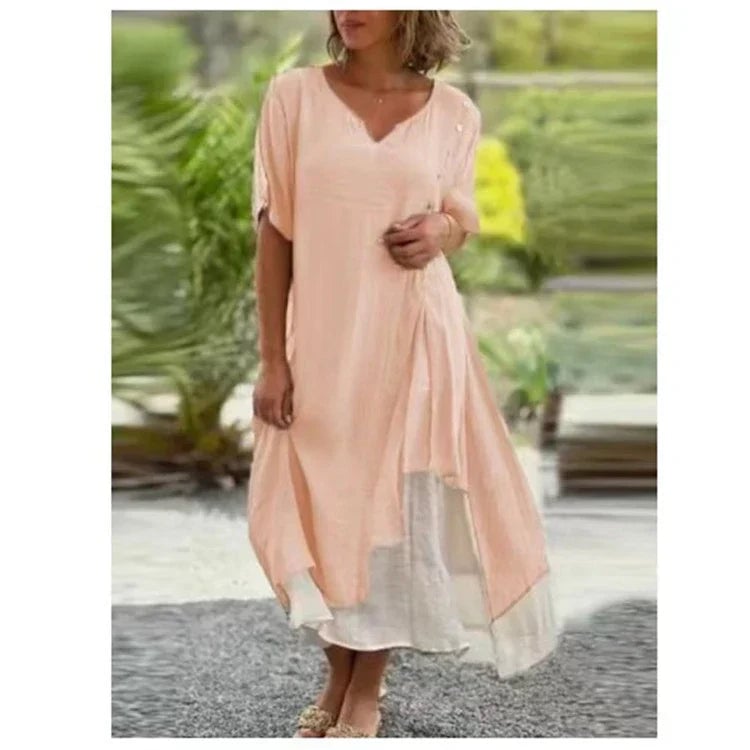 Model wearing the Serena layered midi dress in light pink, full-length view showing the midi length and relaxed fit