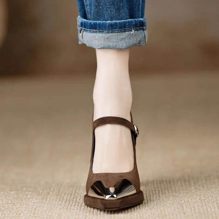 Close-up of patent black cap toe detail on the Serena Mary Jane pump in brown