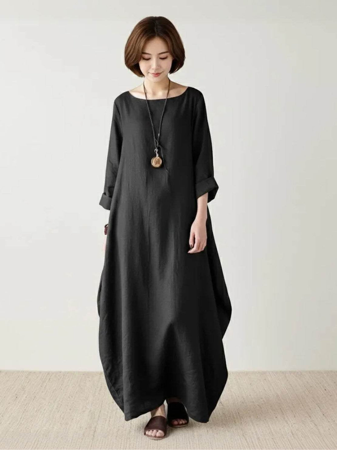 Close-up of the Serena maxi dress in Royal Blue showing draped batwing sleeve detail