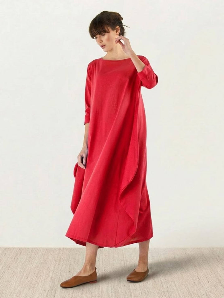 Woman in the Serena maxi dress in Royal Blue styled with flat sandals, full-length lifestyle shot