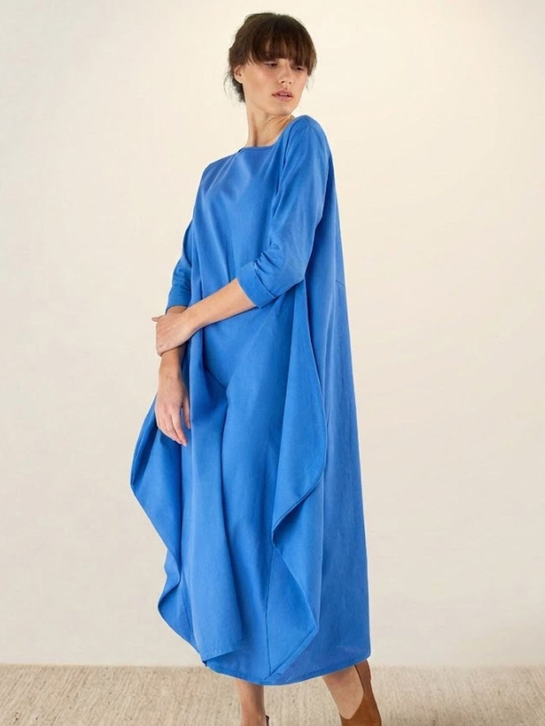 Full-length lifestyle shot of woman in Serena maxi dress in Black styled casually