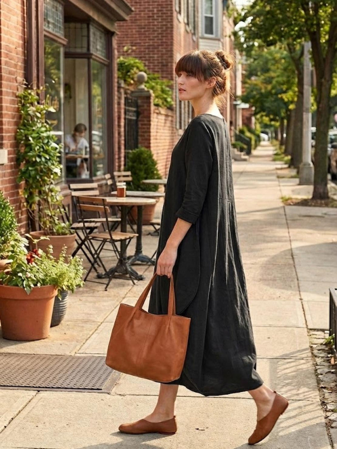 Woman wearing the Serena oversized boho maxi dress in Dark Green, front view