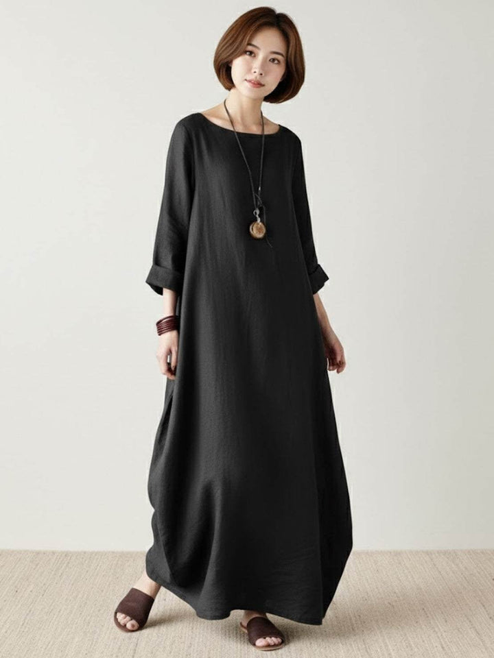 Back view of the Serena boho maxi dress in Dark Green, floor-length silhouette