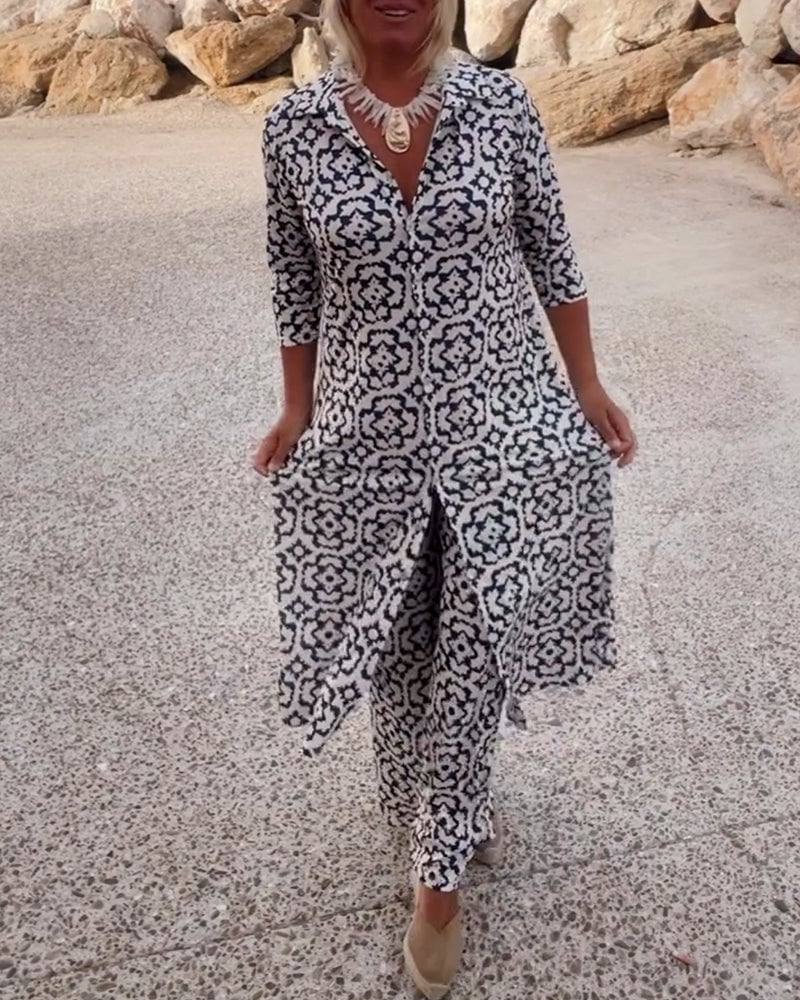 Woman wearing the Serena navy blue geometric print blouse and matching slim pants two-piece set