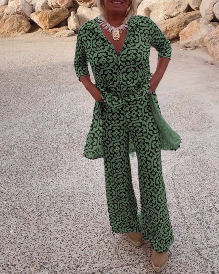 Close-up of the 3/4 sleeve and button detail on the Serena blouse in green