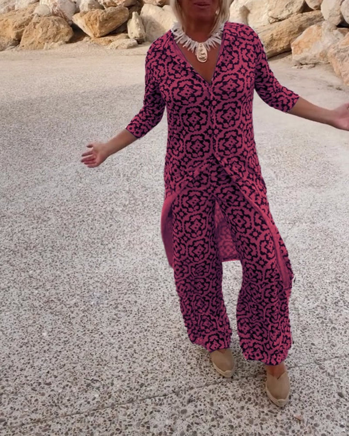 Front view of the Serena fuchsia printed set showing the open-front lapel blouse and slim pants