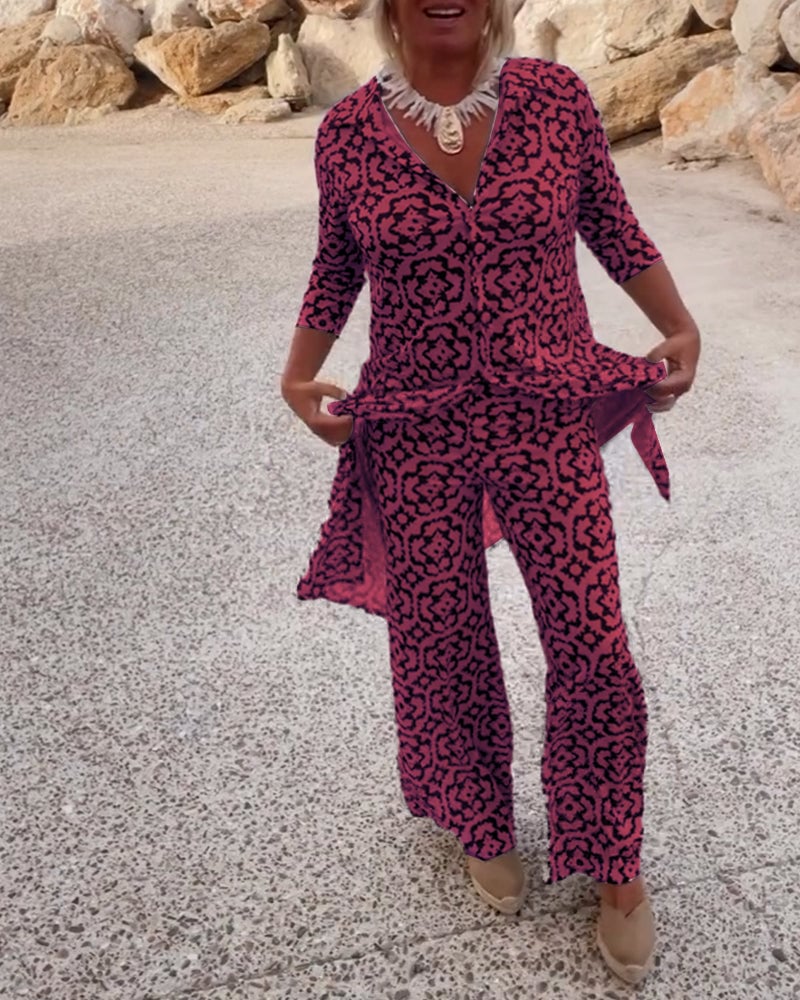 Detail shot of the Serena fuchsia blouse neckline and coordinated pants waistband