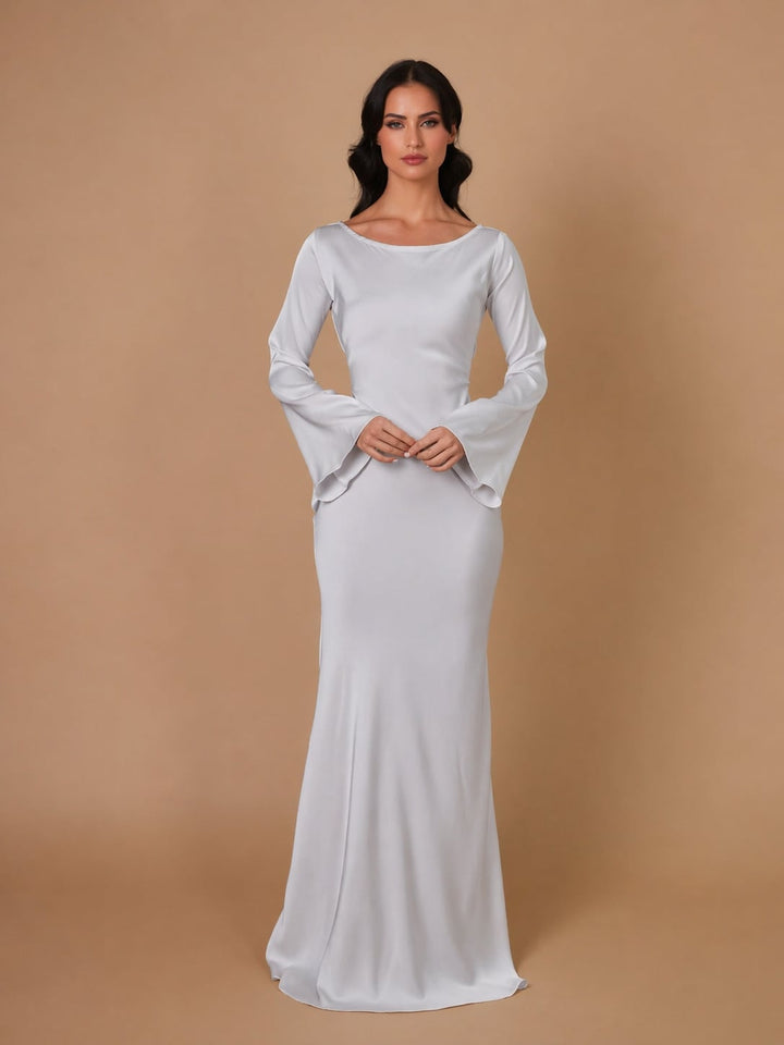 Back view of the Serena ivory satin formal gown showing flowing floor-length skirt