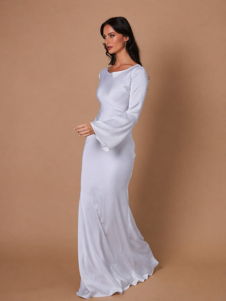 Woman wearing the Serena black satin long sleeve maxi dress, front view