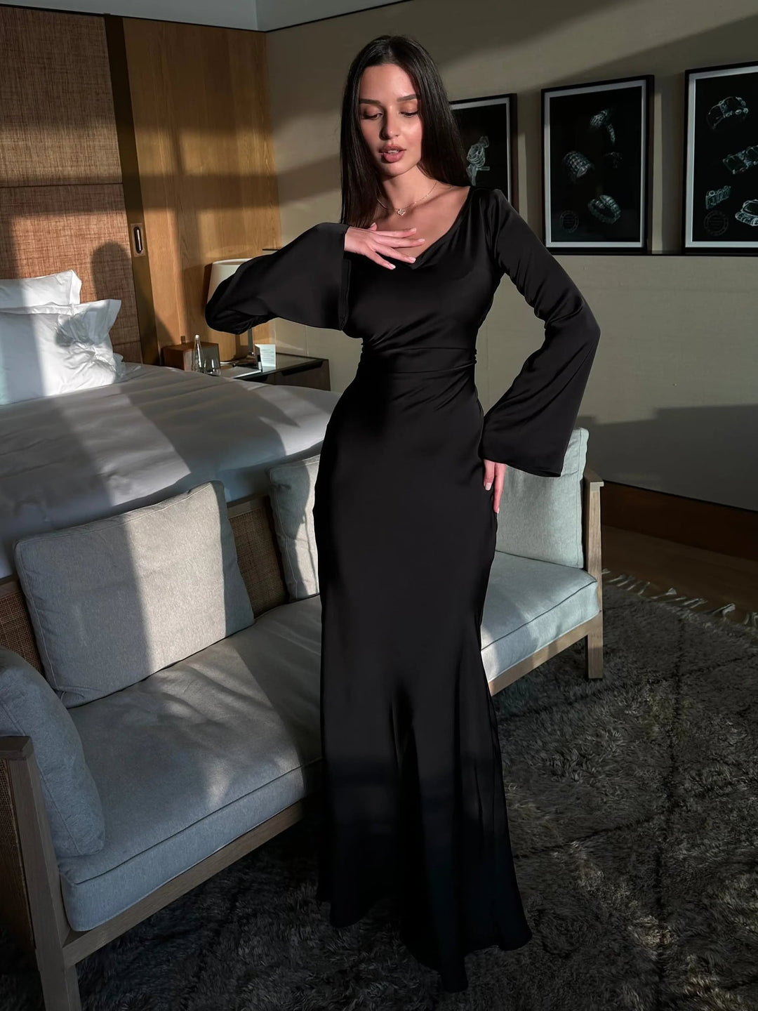 Woman wearing the Serena wine red satin long sleeve maxi dress, front view