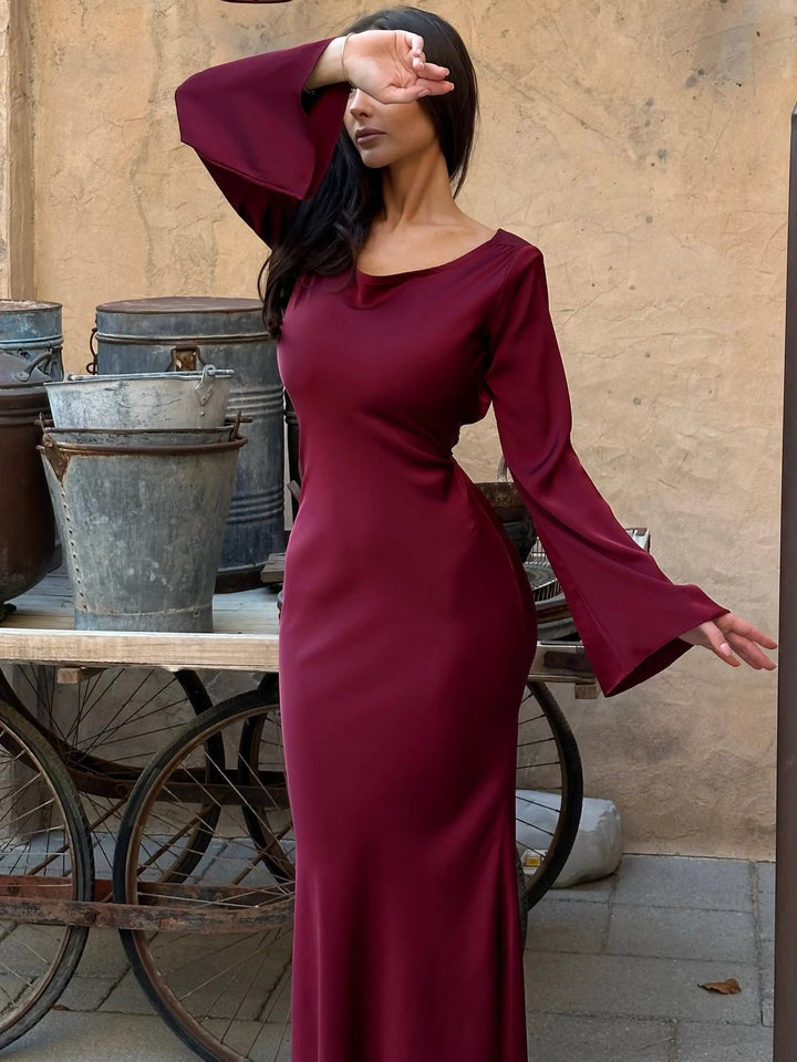 Flat lay of Serena satin maxi dress in all three colors: ivory, black, and wine red