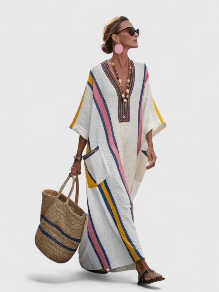 Side view of the Serena white and pink stripe kaftan maxi dress showing flowing oversized silhouette