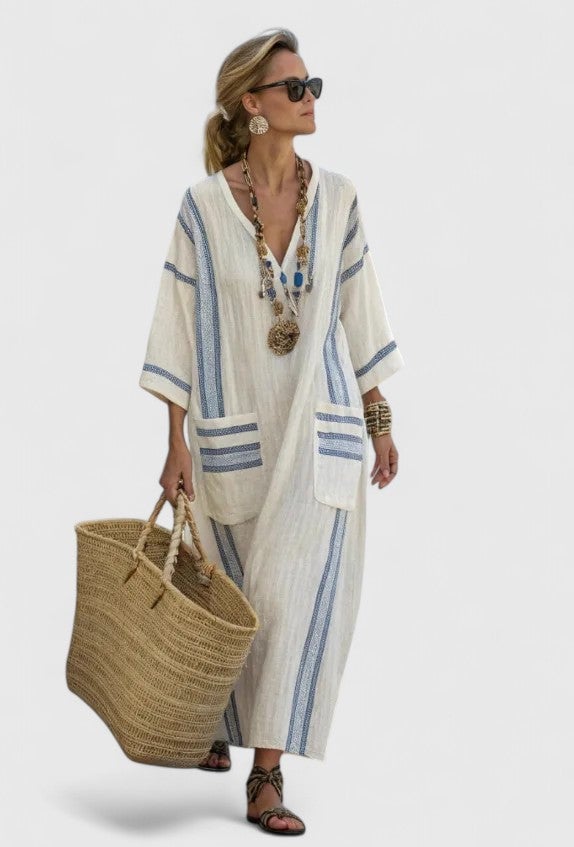 Close-up of contrast stripe cuff and patch pocket trim detail on the Serena kaftan maxi dress in beige green