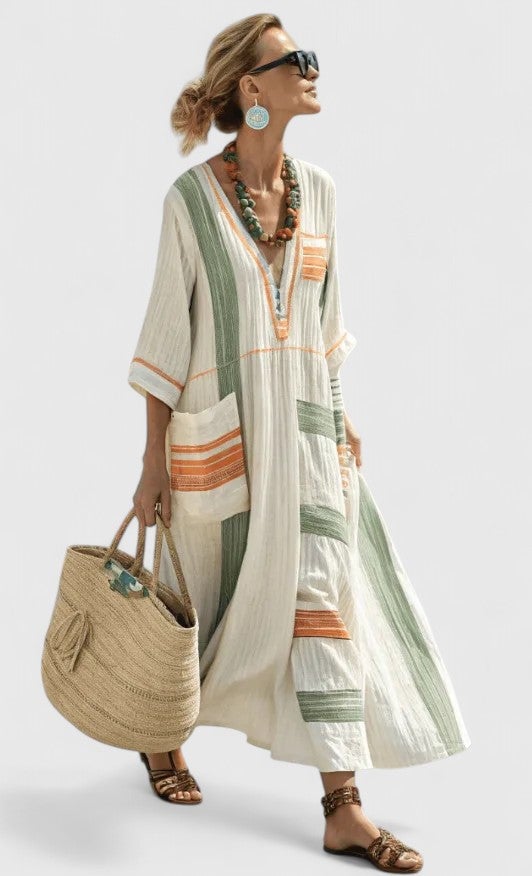 Model wearing the Serena kaftan maxi dress in beige green showing all-over fit and length