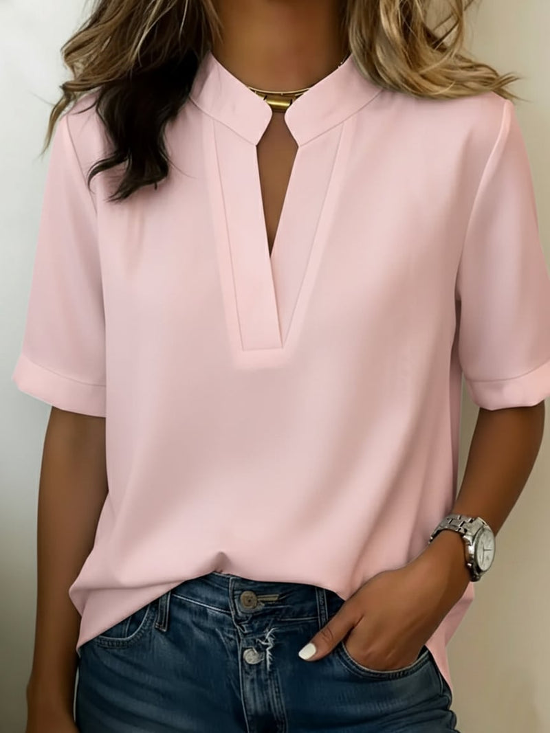 Close-up of the cuffed short sleeve detail on the Serena V-neck blouse