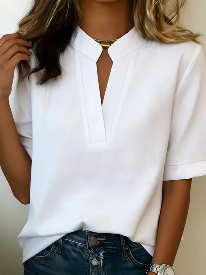Multiple color options of the Serena V-neck blouse including pink, red, and green