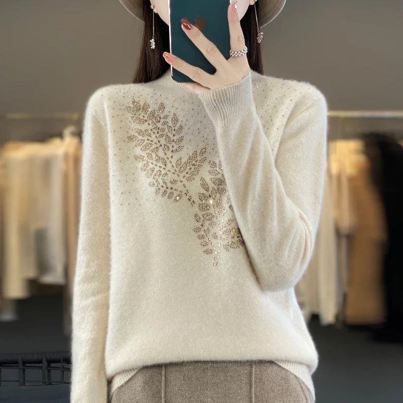 Model wearing the Serenella Embellished Sweater in a relaxed fit with delicate leaf-inspired embellishments