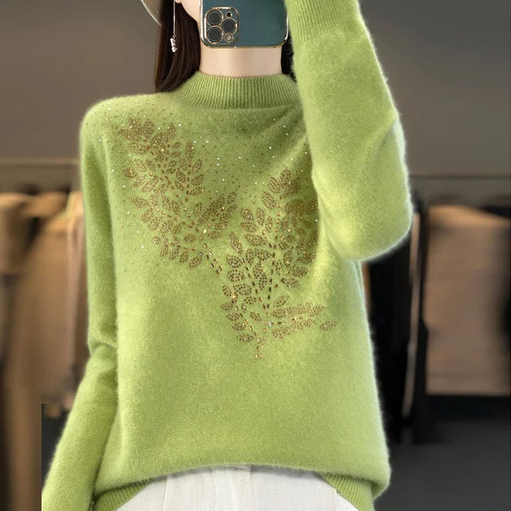 Side profile of the Serenella Embellished Sweater styled with tailored trousers