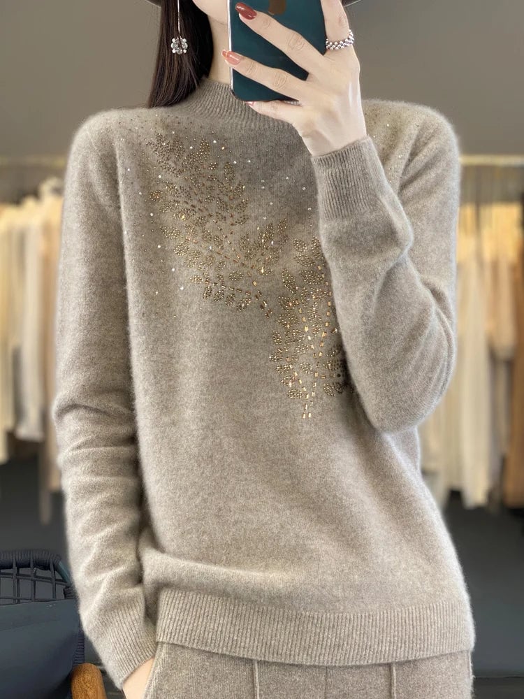 Serenella Embellished Sweater in White colorway styled casually with denim