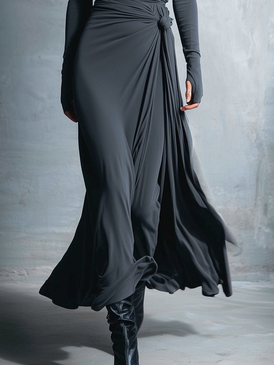 Overhead flat lay of wrap maxi dress options in multiple colors including black and burgundy