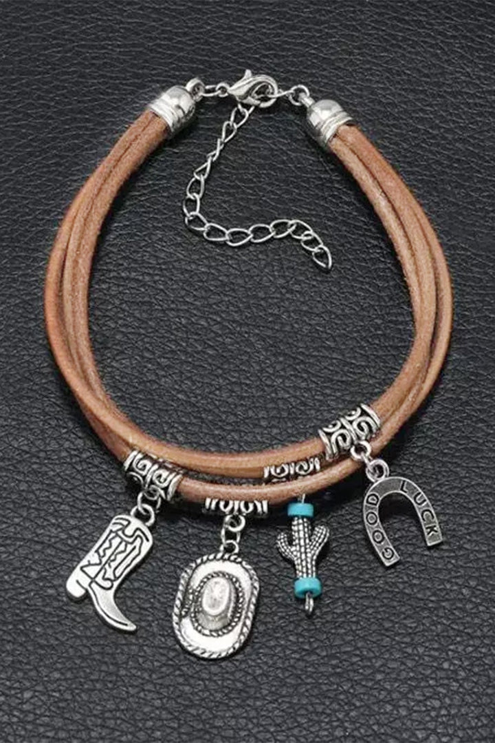 Silver cactus bracelet stacked with other bracelets on a wrist