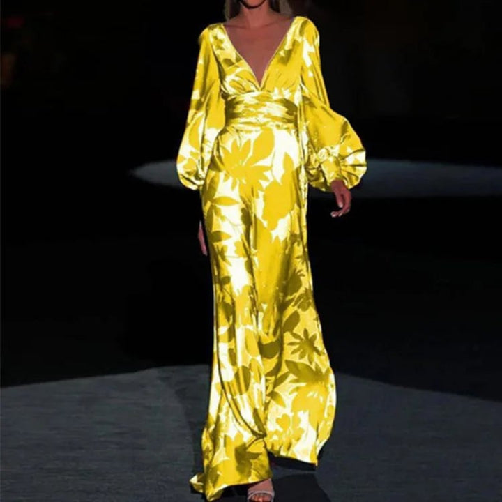 Front view of the Seste floral satin maxi dress in yellow, showing the wrap V-neck and gathered puff sleeves