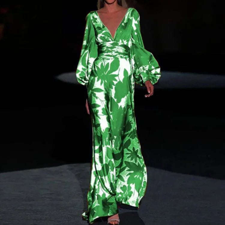 Side view of the Seste floral satin maxi dress in green, highlighting the flowing column skirt silhouette