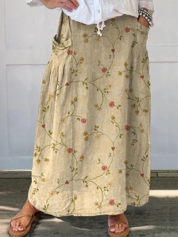 Beige retro floral A-line skirt with elastic waistband and side pockets, shown in full length