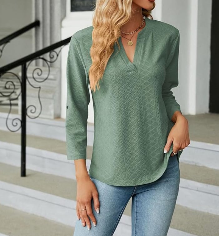 Front view of the Shanice blouse in green with a relaxed fit and subtle button details