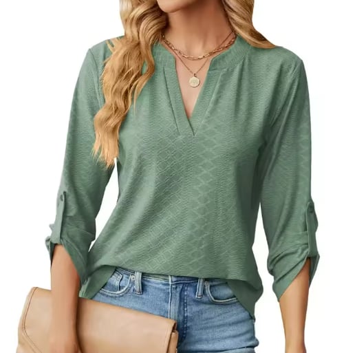 Side view of the Shanice blouse in green highlighting the structured relaxed silhouette