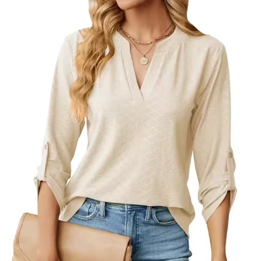 Flat lay of the Shanice blouse in green displaying its soft, breathable fabric