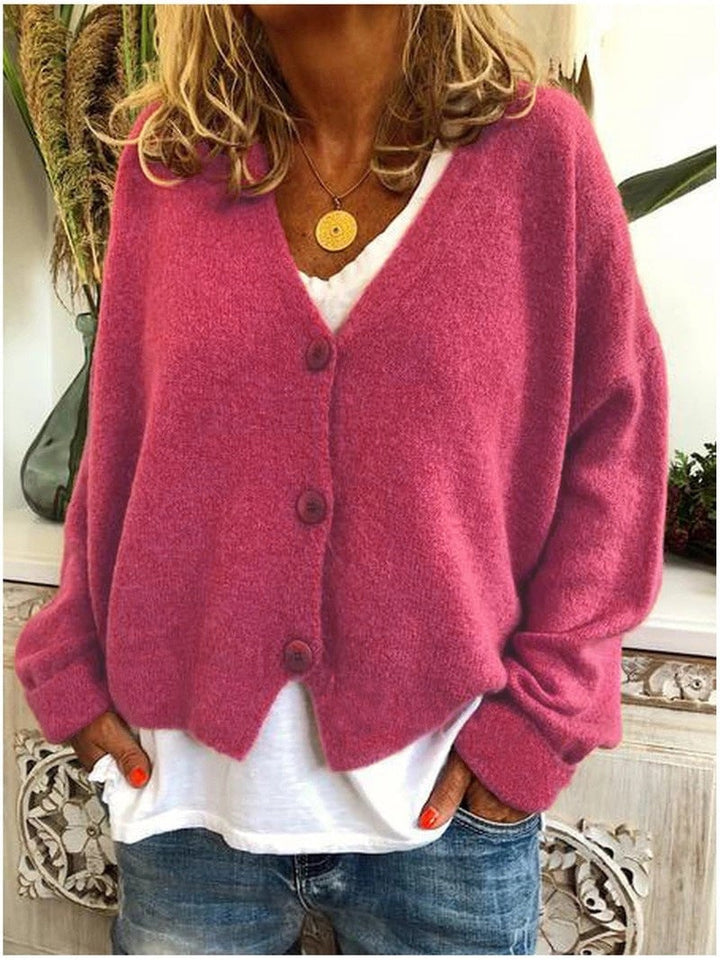 Full-length view of model wearing the Shannon knit cardigan in a warm-toned color option