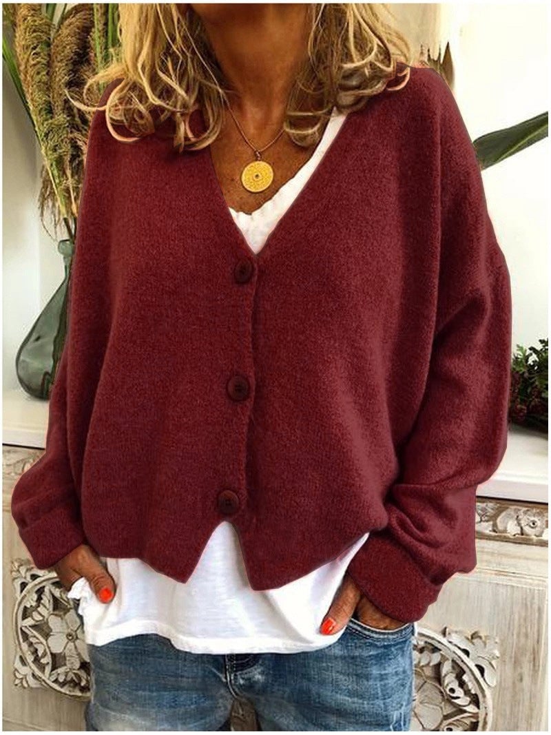 Shannon cardigan in a cool-toned color, draped over shoulders for a casual weekend style