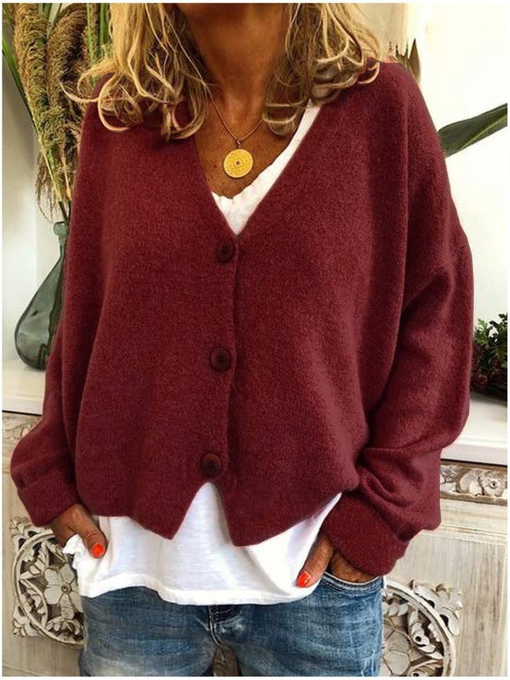 Shannon cardigan in a cool-toned color, draped over shoulders for a casual weekend style
