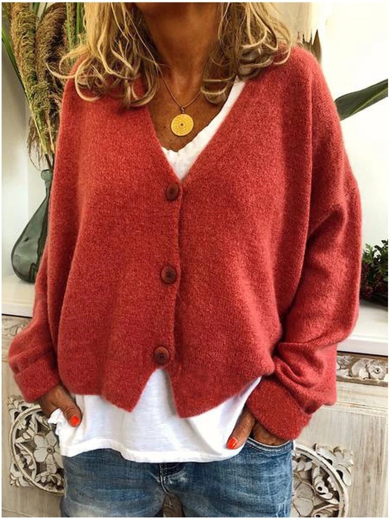 Model wearing the Shannon knit cardigan in a vibrant color option against a neutral background