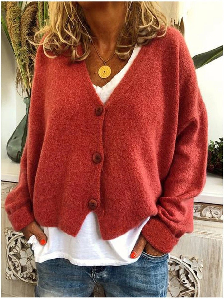 Model wearing the Shannon knit cardigan in a vibrant color option against a neutral background