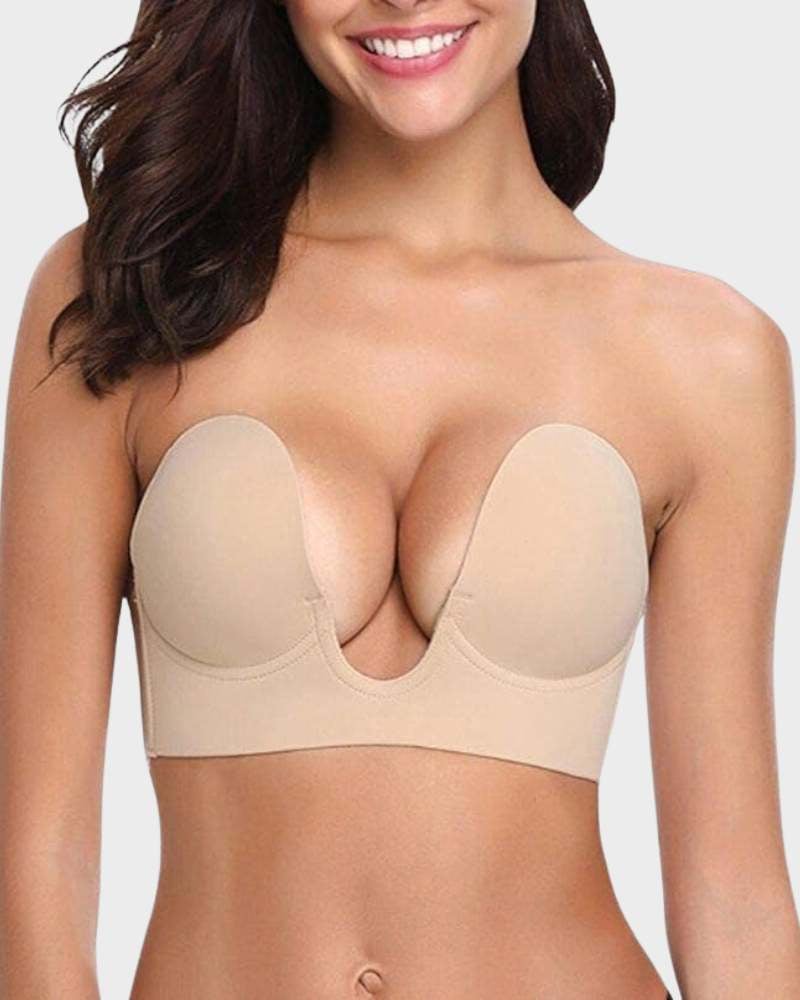 Woman wearing a champagne seamless push-up plunge bra with adjustable straps and smooth, wireless cups
