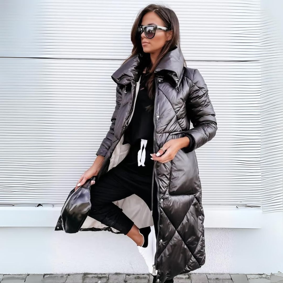 Woman wearing the Sharon elegantly warm winter coat in black, showing the softly structured feminine silhouette