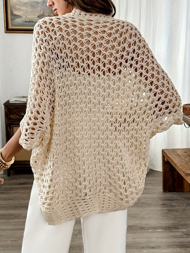 Side view of woman in beige draped knit cardigan showing easy movement and flattering fit
