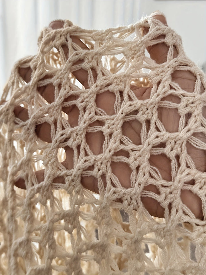 Full-length lifestyle photo of woman wearing beige open knit drape cardigan in natural light