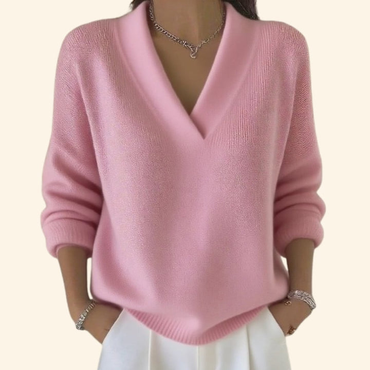 Close-up detail of the flattering V-neckline on a lightweight women's blouse