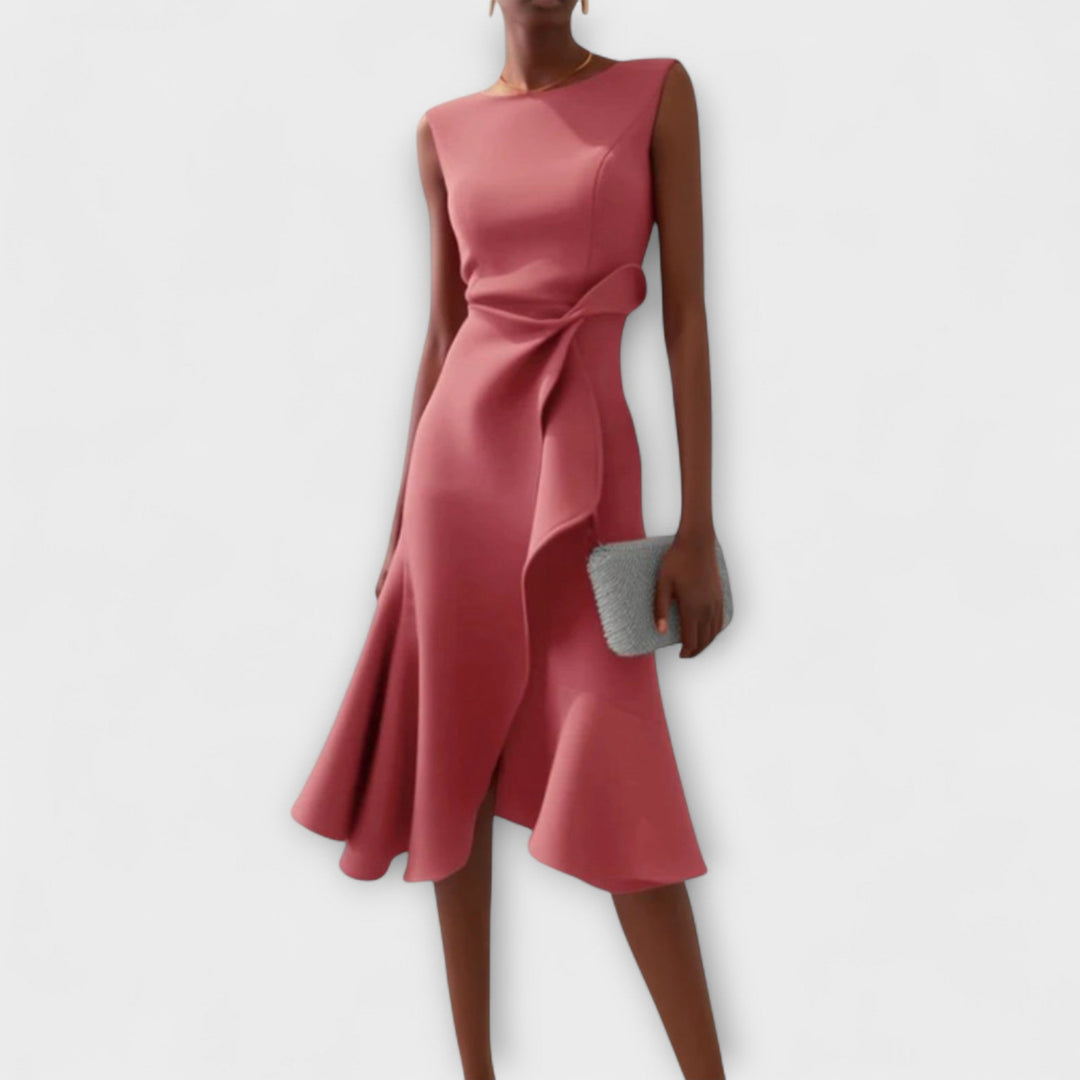 Close-up detail of the soft draped fabric and asymmetric hem on the midi dress