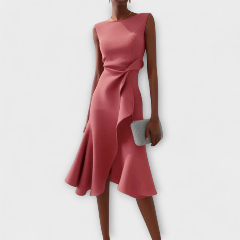 Close-up detail of the soft draped fabric and asymmetric hem on the midi dress