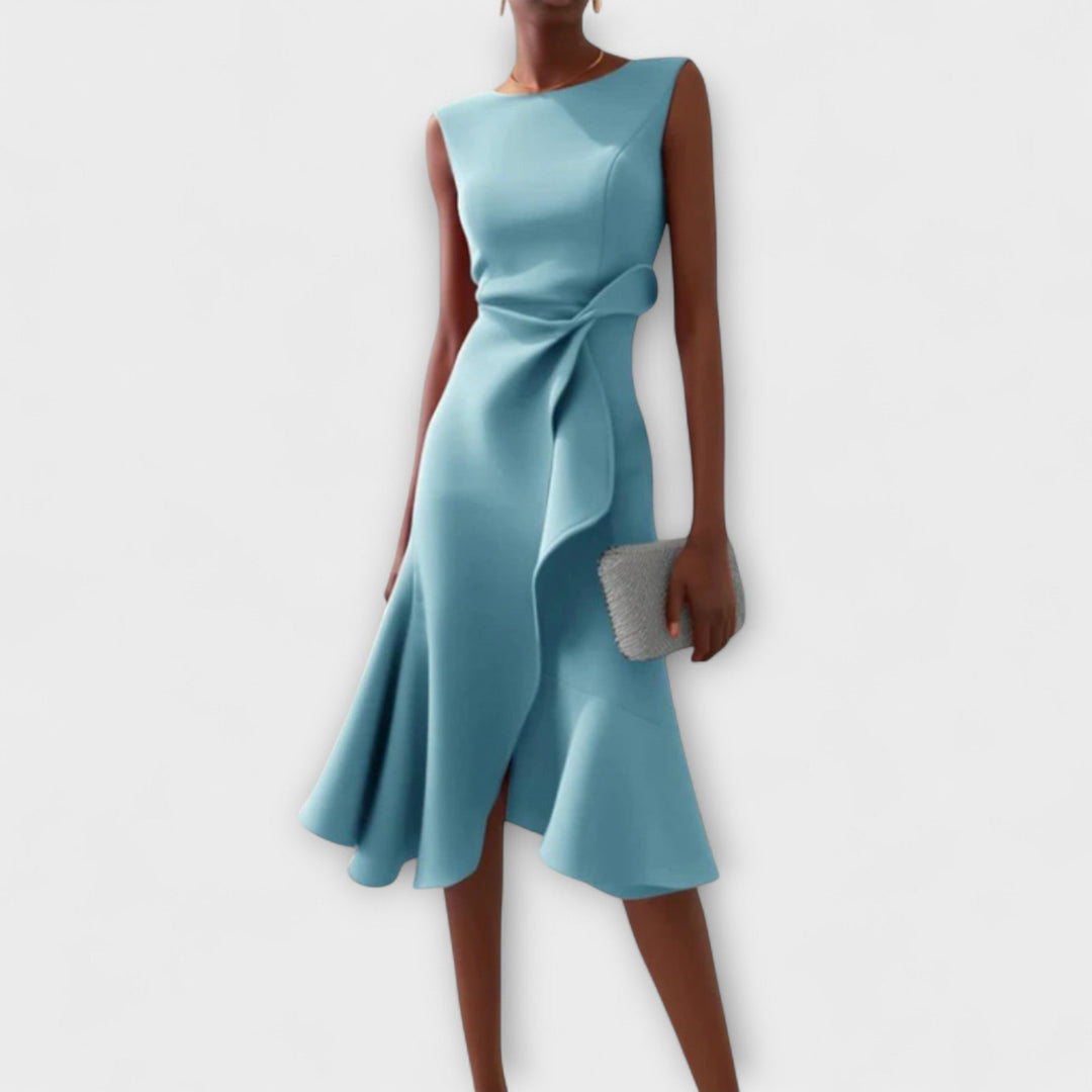 Model wearing the draped asymmetric midi dress in a solid color, full-length front view