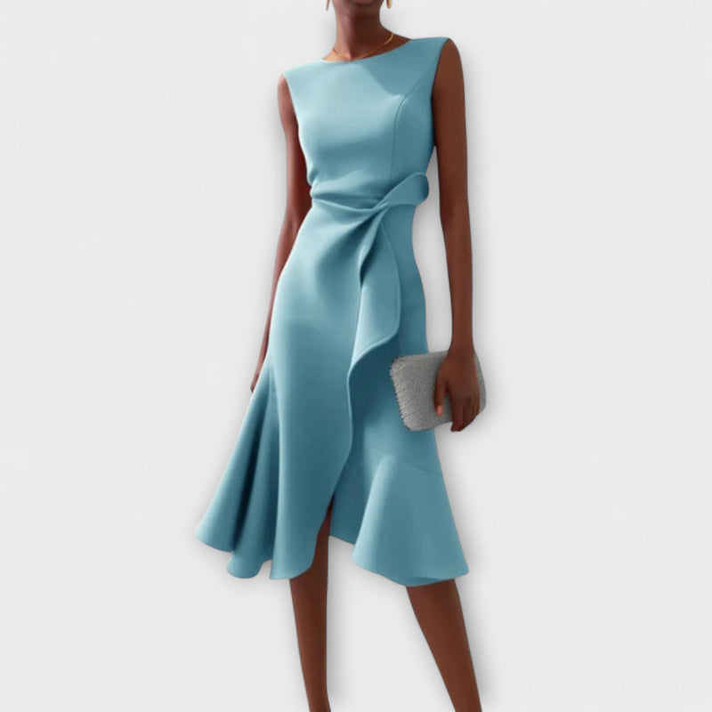 Model wearing the draped asymmetric midi dress in a solid color, full-length front view