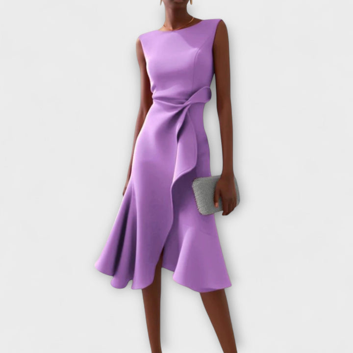 Side profile of the draped asymmetric midi dress showing the midi length and silhouette