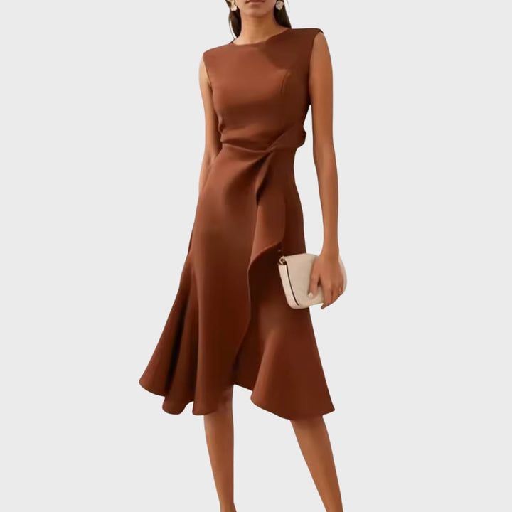 Full-length shot of the asymmetric midi dress in motion, showcasing fabric flow