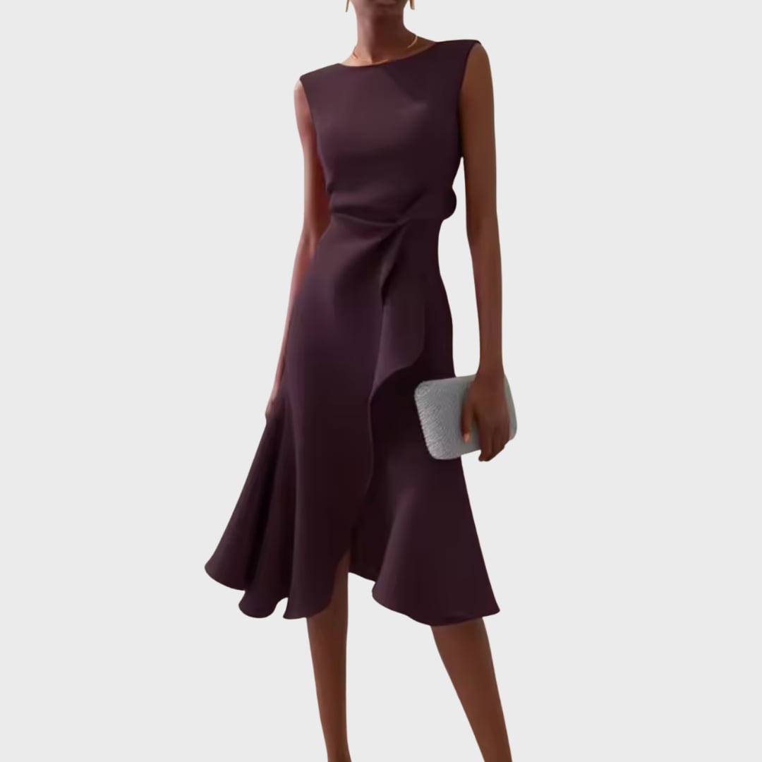 Close-up of the asymmetric hem detail on the midi dress
