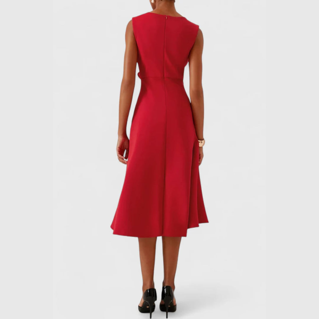 Studio shot of model in the draped asymmetric midi dress, full-length elegant pose