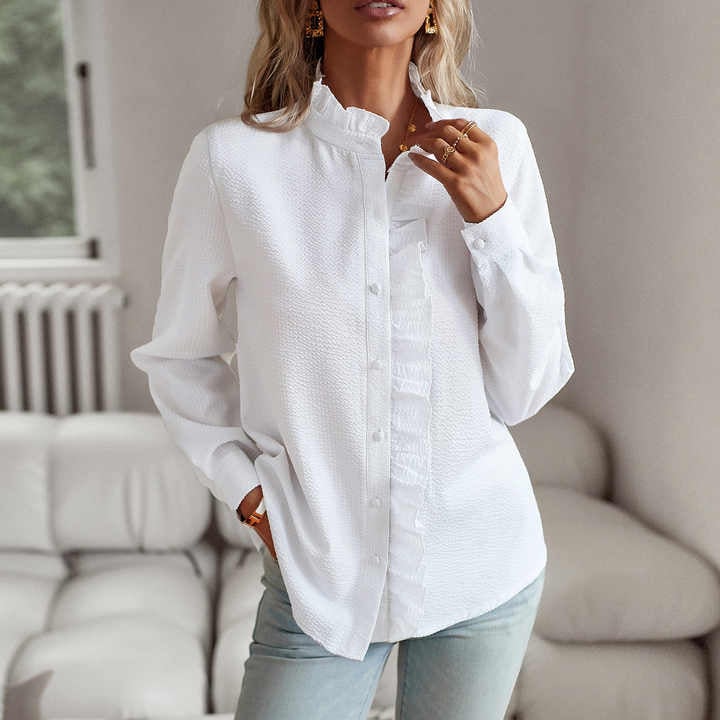 Close-up of the delicate pleating and lightweight fabric detail on the Sheri long-sleeve blouse